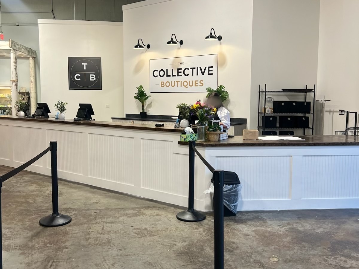 A single checkout counter with several registers serving a whole multi-vendor store